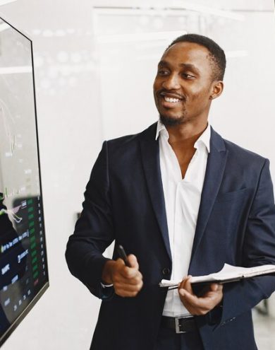 african-man-black-suit-big-tv-screen-guy-shows-presentation_1157-48542.jpg